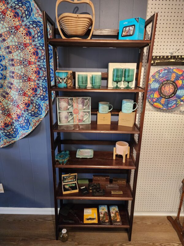 Drinking glasses, vintage pocket knives and other finds on HodgePodge display shelves