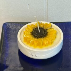 sunflower candle in round dish