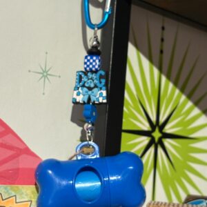 Doggie poop bags on carabiner clip with charms